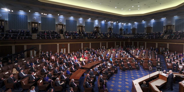 President Joe Biden delivers his first State of the Union address to a joint session of Congress at the Capitol, Tuesday, March 1, 2022, in Washington as Vice President Kamala Harris and House speaker Nancy Pelosi of Calif., applaud. (Julia Nikhinson/Pool via AP)