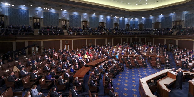President Joe Biden delivers his first State of the Union address to a joint session of Congress at the Capitol, Tuesday, March 1, 2022, in Washington as Vice President Kamala Harris and House speaker Nancy Pelosi of Calif., applaud. (Julia Nikhinson/Pool via AP)
