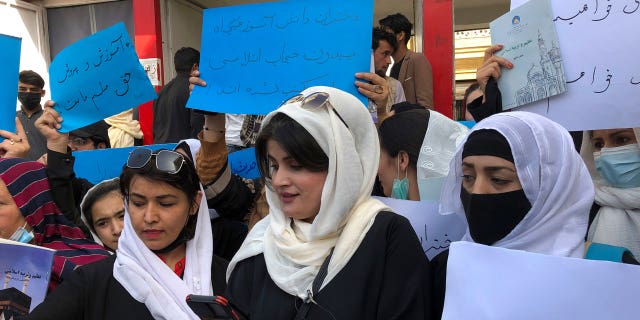 Afghan women chant and hold signs to protest during a demonstration in Kabul, Afghanistan, Saturday, March 26, 2022. 