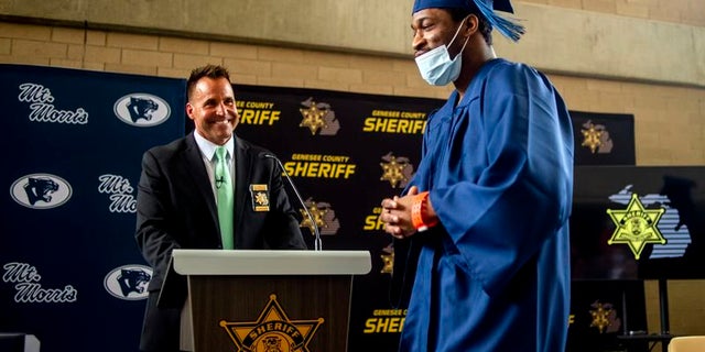 Sheriff Chris Swanson attends graduation ceremony.