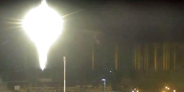 Screenshot from video released by Zaporizhzhia nuclear power plant shows bright flaring object landing in grounds of the nuclear plant in Enerhodar, Ukraine.
