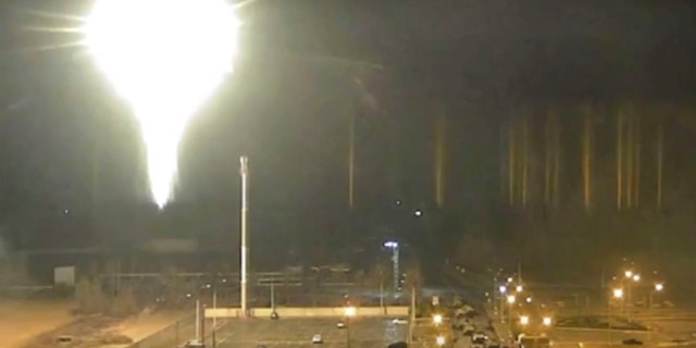 Screenshot from video released by Zaporizhzhia nuclear power plant shows bright flaring object landing in grounds of the nuclear plant in Enerhodar, Ukraine.