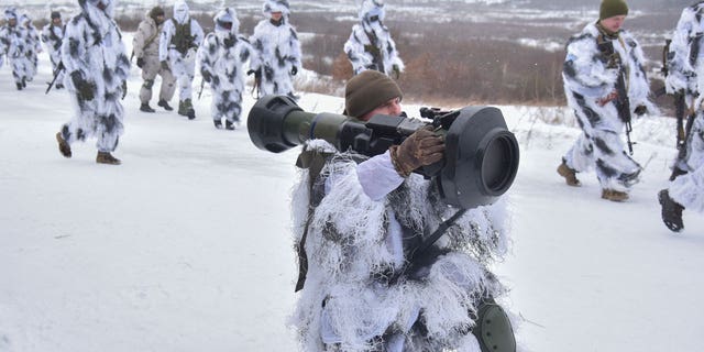 Ukrainian soldiers take part in an exercise for the use of NLAW anti-tank missiles at the Yavoriv military training ground, close to Lviv, western Ukraine, Friday, Jan. 28, 2022.