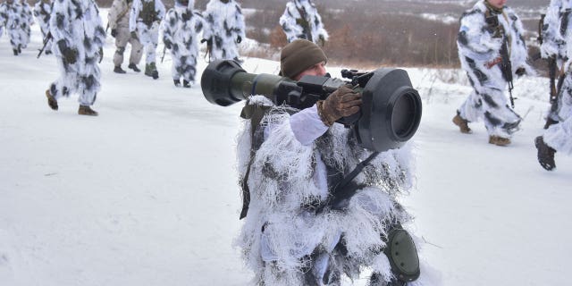 Ukrainian soldiers take part in an exercise on the use of NLAW anti-tank missiles at the Yavoriv military training ground near Lviv in western Ukraine, Friday, January 28, 2022.