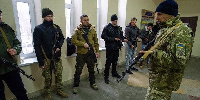 An instructor discusses urban combat as Ukrainian civilians undergo basic military training at a volunteer center in a state educational institution, before an expected Russian assault on March 5, 2022, in Odessa, Ukraine.