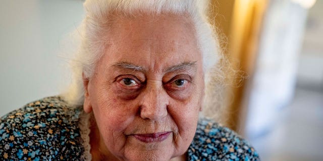 Ukrainian Holocaust survivor Galina Ulyanova looks on during an AP interview in an old people's home in Frankfurt, Germany, Sunday, March 27, 2022. As the war in Ukraine continues to get more brutal, Jewish organizations are trying to evacuate as many of the 10,000 Holocaust survivors living there as possible.