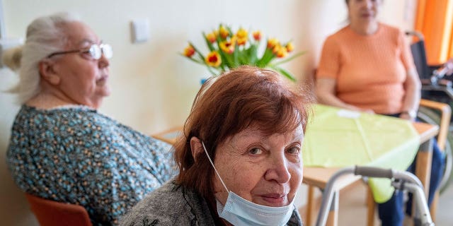 Ukrainian Holocaust survivor Larisa Dzuenko looks on during an AP interview in an old people's home in Frankfurt, Germany, Sunday, March 27, 2022.