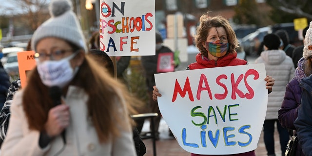 People gather in support of continuing the school mask mandate outside the Loudon County Government Center prior to a Board of Supervisors meeting on Tuesday January 18, 2022 in Leesburg, VA. 