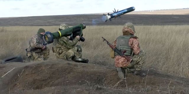 In this image taken from footage provided by the Ukrainian Defense Ministry Press Service, a Ukrainian soldiers use a launcher with US Javelin missiles during military exercises in Donetsk region, Ukraine, Wednesday, Jan. 12, 2022. 