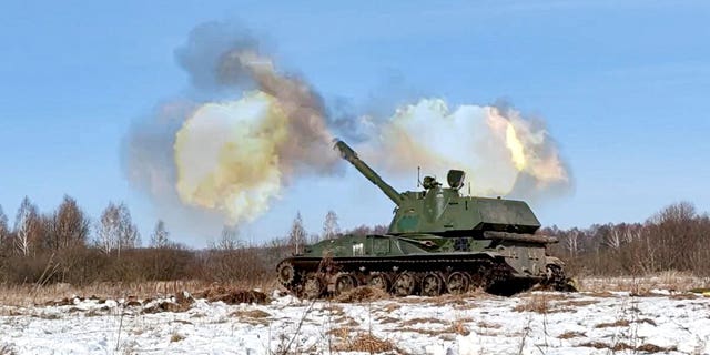 In this photo taken from video provided by the Russian Defense Ministry Press Service on Tuesday, Feb. 15, 2022, a self-propelled artillery mount fires at the Osipovichi training ground during the Union Courage-2022 Russia-Belarus military drills in Belarus. 