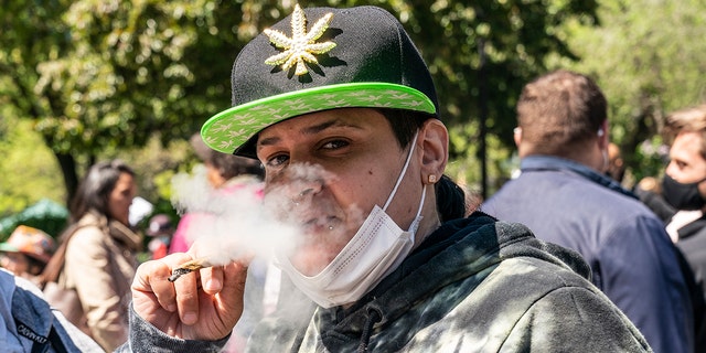 People congregate on Union Square May 1, 2021, in New York for an annual cannabis rally to celebrate legalization of recreational marijuana in New York state.