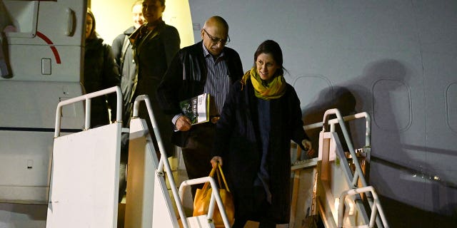 Nazanin Zaghari-Ratcliffe and Anoosheh Ashoori disembark from a plane at Brize Norton air base in England Thursday, March 17, 2022.