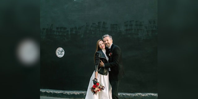 The couple poses after getting married