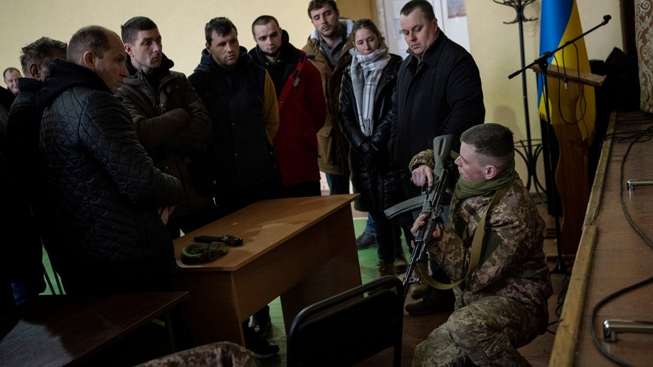 Ukrainian civilians receive weapons training, in the outskirts of Lviv, western Ukraine