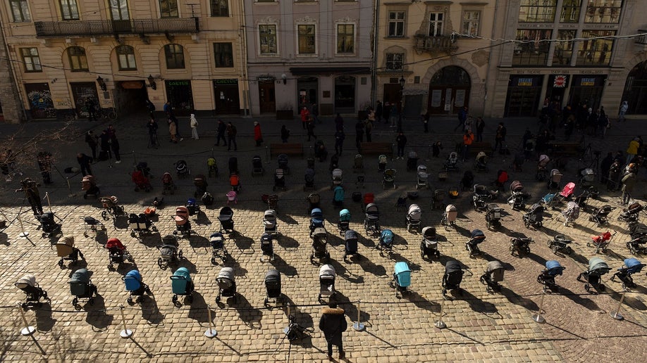 empty strollers are seen placed outside the Lviv