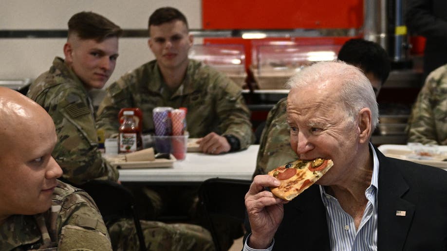 Biden eating pizza in Poland