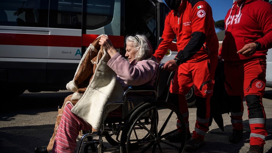 Ukrainian woman on a wheelchair evacuated from Lviv by Italian Red Cross arrives to Rome, on March 22, 2022 in Rome, Italy. About 80 frail people including children, elderly and disabled were evacuated from Lutsk, Kharhiv and Kiev by the Italian Red Cross in collaboration with the Civil Protection Department. (Photo by Antonio Masiello/Getty Images)
