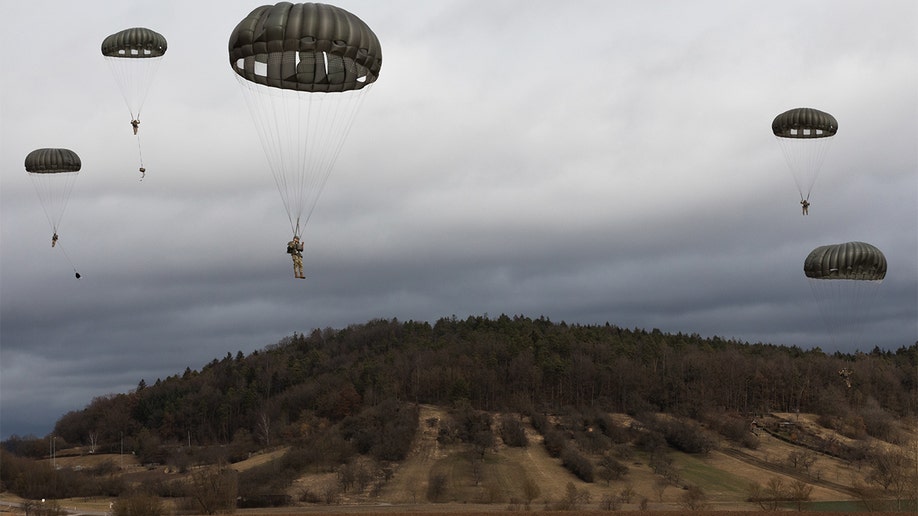 U.S. Army paratroopers approach the landing zone during airborne training in Renningen, Germany, Feb. 16, 2022. (U.S. Army photo by Spc. Michael Germundson)