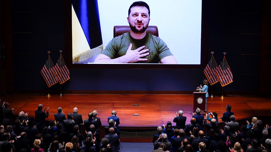 Speaker of the House Nancy Pelosi, D-Calif., introduces Ukrainian President Volodymyr Zelenskyy to speak to the U.S. Congress by video at the Capitol in Washington, Wednesday, March 16, 2022. (AP Photo/J. Scott Applewhite, Pool)