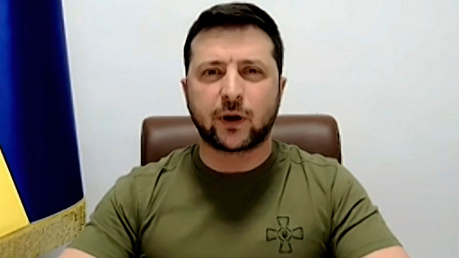 In this image from video provided by the House Television, Ukrainian President Volodymyr Zelenskyy speaks from Kyiv, Ukraine, as he addresses virtually addresses Congress on Wednesday, March 16, 2022. (House Television via AP)