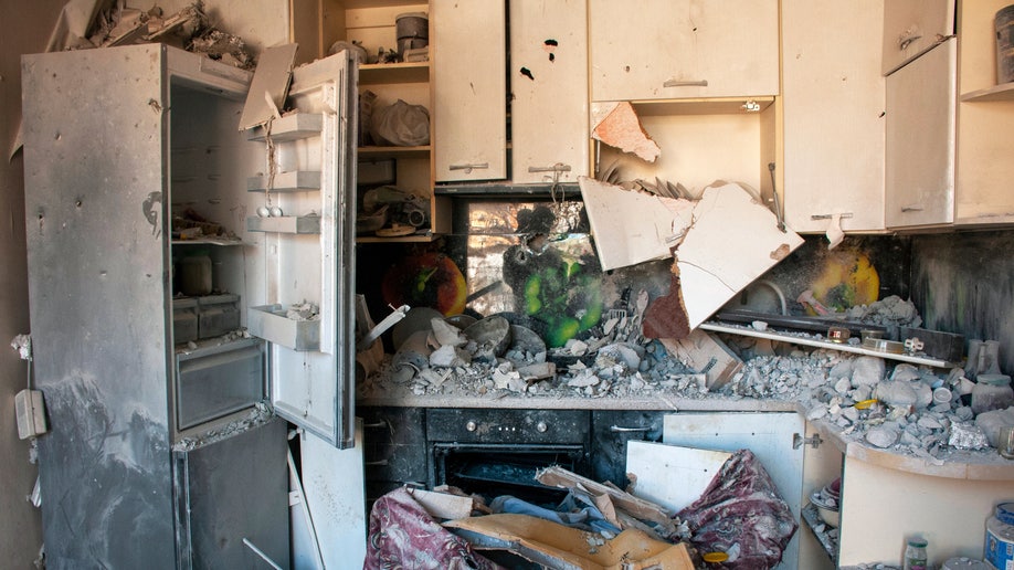 Destroyed kitchen in apartment building Ukraine