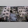 Firefighters extinguish an apartment house after a Russian rocket attack in Kharkiv, Ukraine's second-largest city, Ukraine, Monday, March 14, 2022.