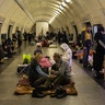 Residents take shelter in the lower level of a Kyiv metro station during Russian artillery strikes in Kyiv, Ukraine, on Wednesday, March 2, 2022.