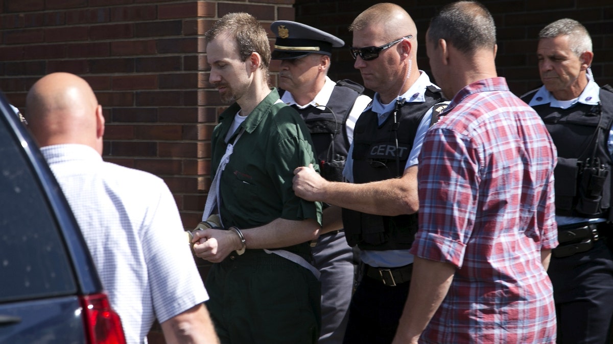 David Sweat is escorted out of the court house following his arraignment at Clinton County court, in Plattsburgh, New York August 20, 2015. Sweat, 35, one of the convicted killers who led law enforcement on an intense three-week manhunt after escaping a maximum-security prison in upstate New York, pleaded not guilty to an escape charge on Thursday. REUTERS/Christinne Muschi