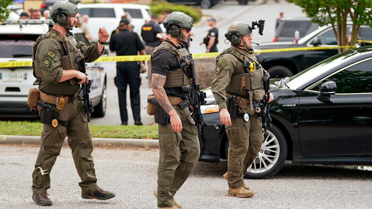 Authorities stage outside Columbiana Centre mall in Columbia, S.C., following a shooting, Saturday, April 16, 2022.