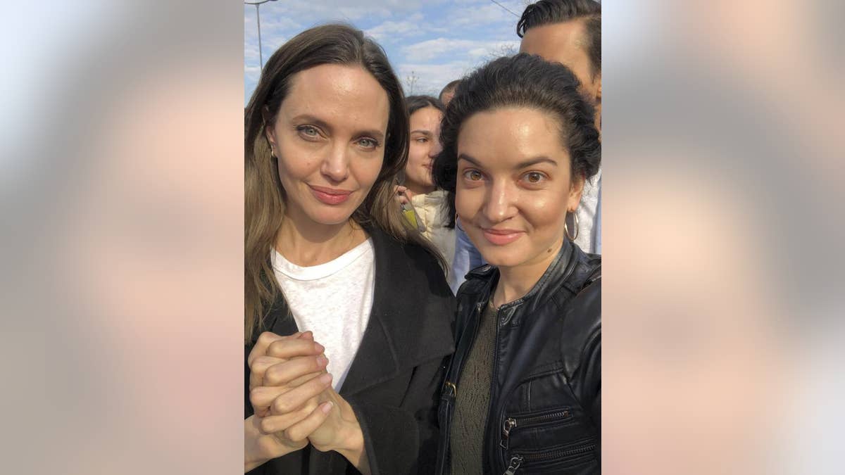 Angelina Jolie, Hollywood movie star and UNHCR goodwill ambassador, poses for photo with her fans in Lviv, Ukraine, Saturday, April 30, 2022.