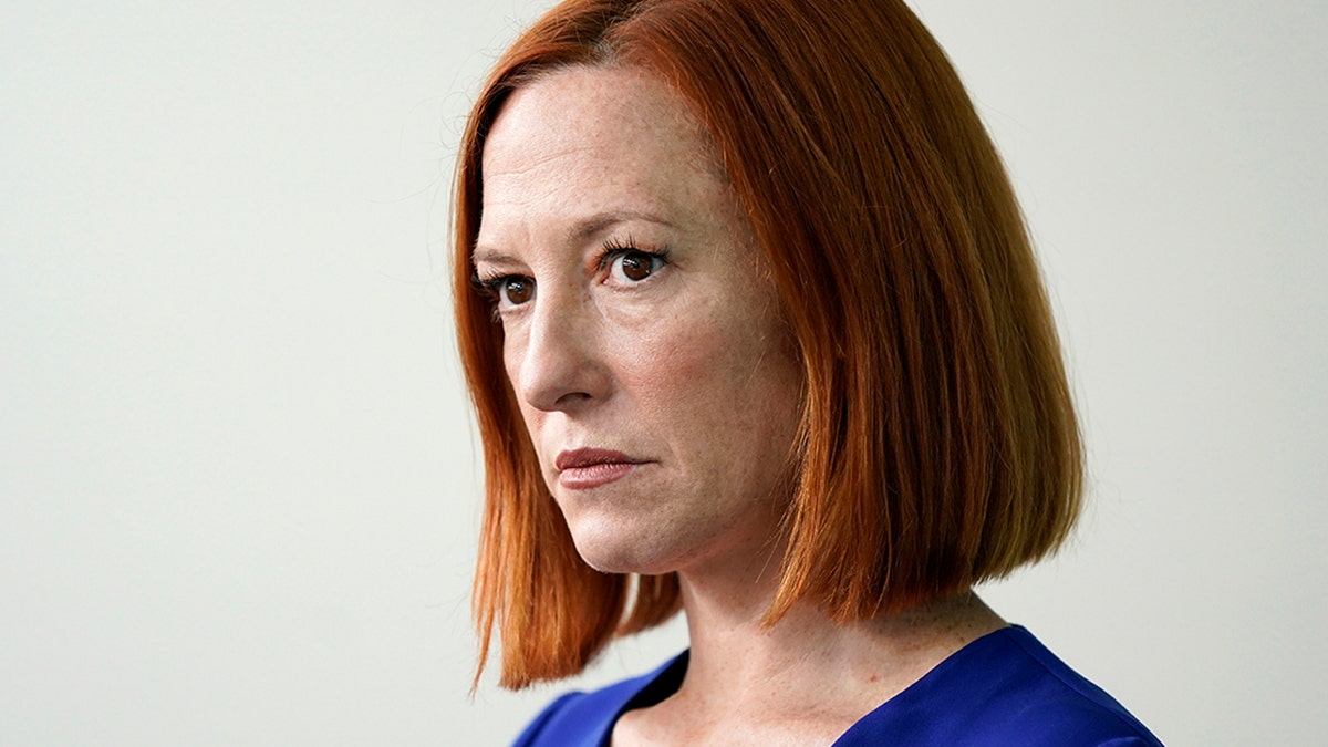 White House press secretary Jen Psaki listens as Council of Economic Advisers member Jared Bernstein speaks during a press briefing at the White House, Friday, April 1, 2022, in Washington.