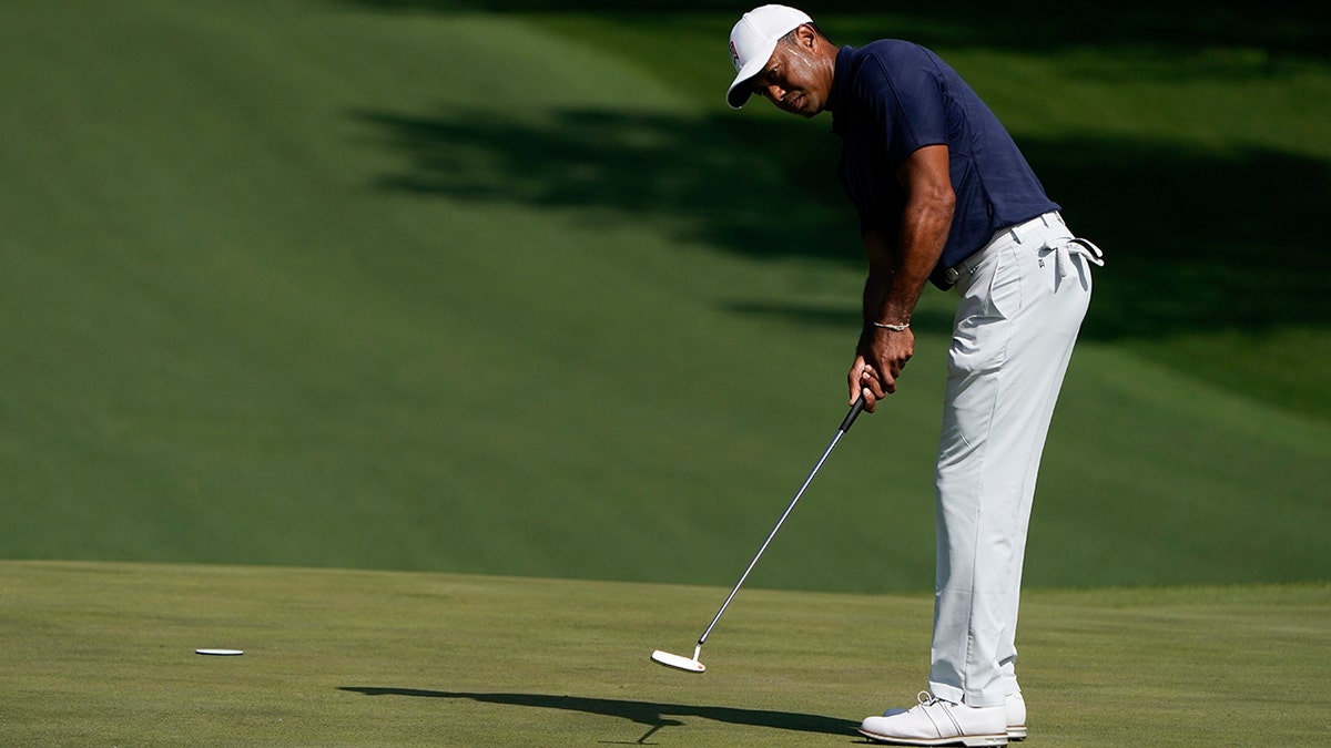 Tiger Woods putts on the fourth green during a practice round for the Masters golf tournament on Monday, April 4, 2022, in Augusta, Ga.