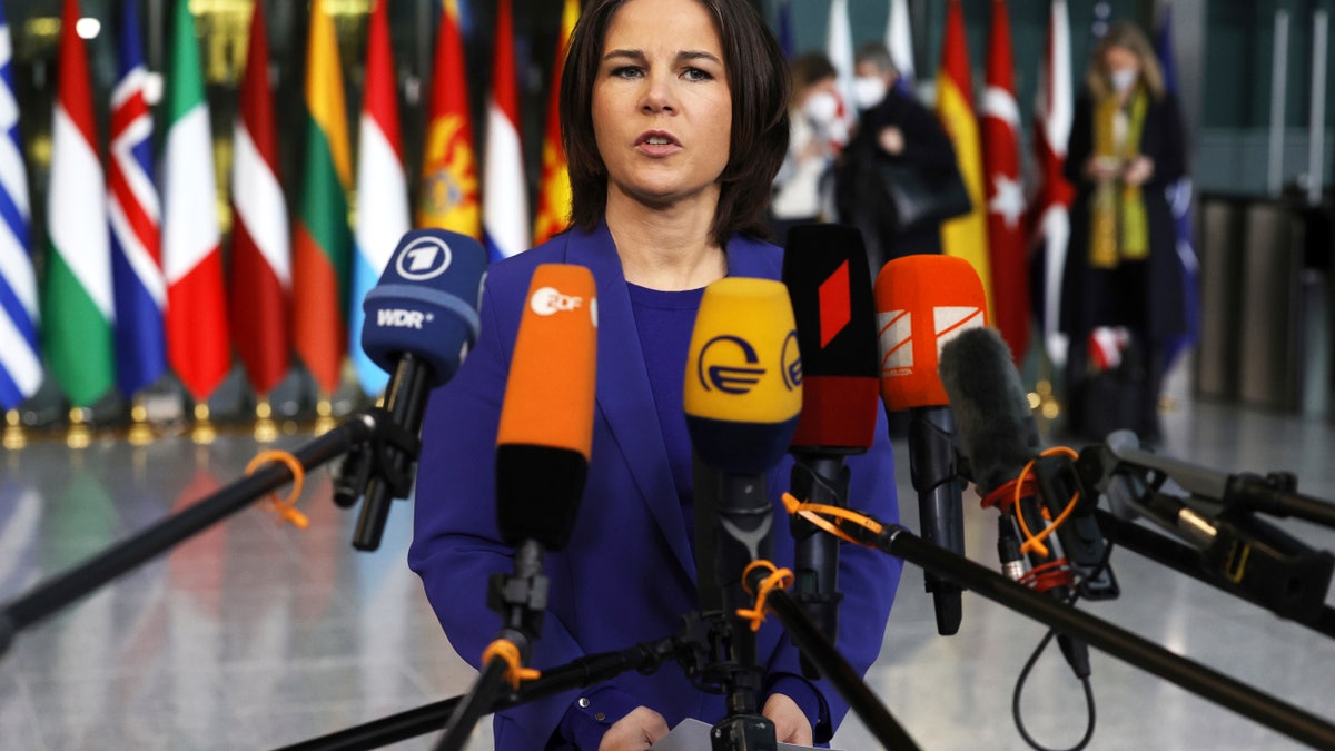 German Foreign Minister Annalena Baerbock speaks with the media as she arrives for a meeting of NATO foreign ministers at NATO headquarters in Brussels, Thursday, April 7, 2022. NATO foreign ministers are meeting to discuss how to bolster their support to Ukraine, including by supplying weapons to the conflict-torn country, without being drawn into a wider war with Russia.