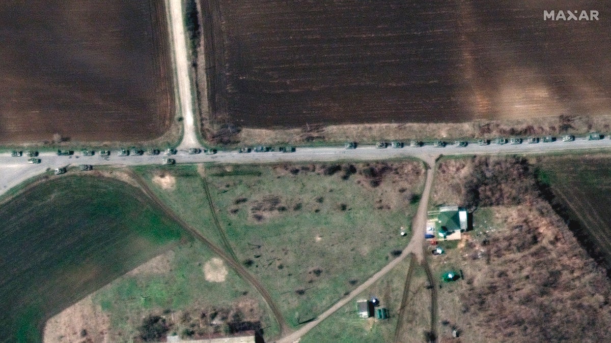 This satellite image provided by Maxar Technologies shows a closer view of a convoy of Russian military vehicles along T-1313 highway near Bilokurakyne, Ukraine, on Monday, April 11, 2022.
