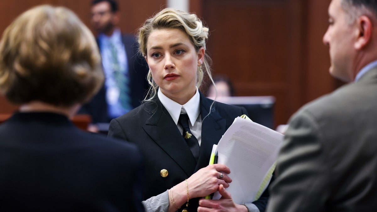 Actor Amber Heard attends Johnny Depp's defamation trial against her at the Fairfax County Circuit Courthouse in Fairfax, Virginia, U.S., April 13, 2022.