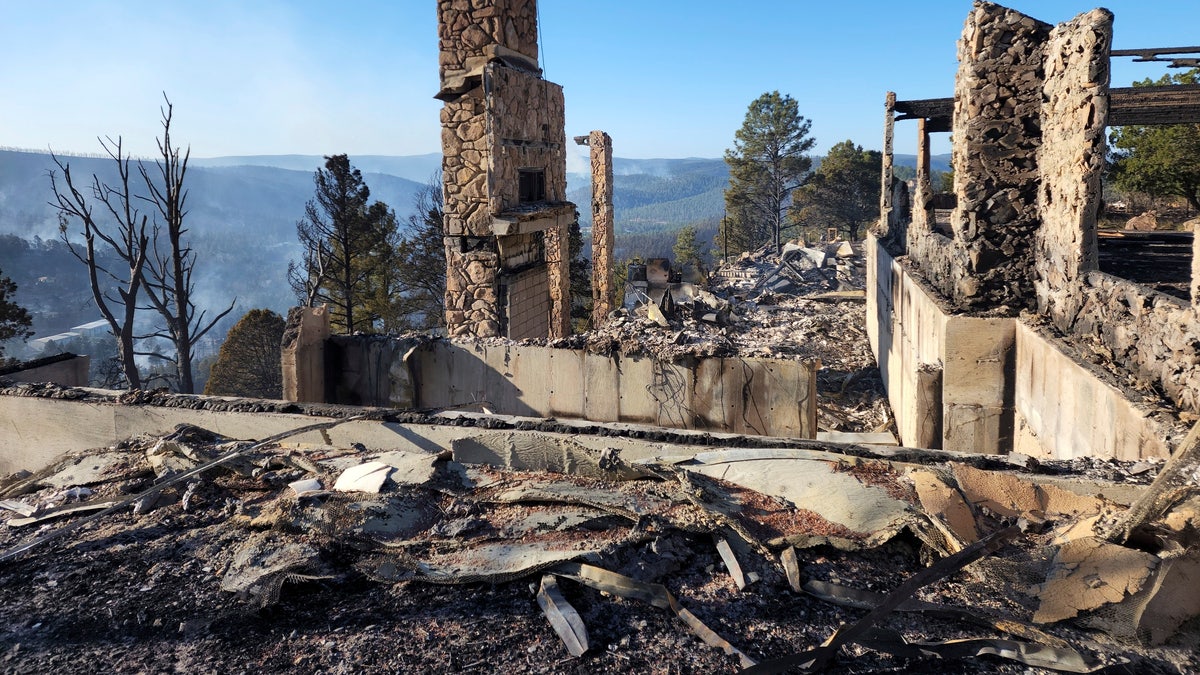 The remains of a home left after a wildfire spread through the Village of Ruidoso, N.M. on Wednesday, April 13, 2022. 