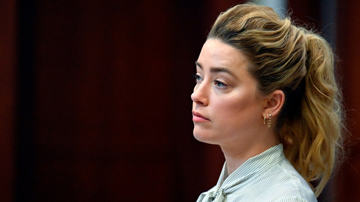 US actress Amber Heard attends trial at the Fairfax County Circuit Courthouse in Fairfax, Virginia, on April 19, 2022. - US actor Johnny Depp is suing ex-wife Heard for libel after she wrote an op-ed piece in The Washington Post in 2018 referring to herself as a ìpublic figure representing domestic abuse.î (Photo by Jim WATSON / POOL / AFP)