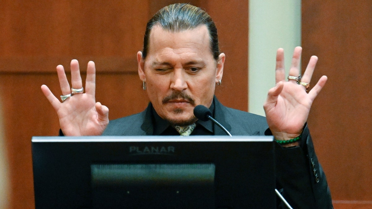 US actor Johnny Depp testifies during his defamation trial in the Fairfax County Circuit Courthouse in Fairfax, Virginia, on April 19, 2022. - Depp is suing ex-wife Amber Heard for libel after she wrote an op-ed piece in The Washington Post in 2018 referring to herself as a ìpublic figure representing domestic abuse.