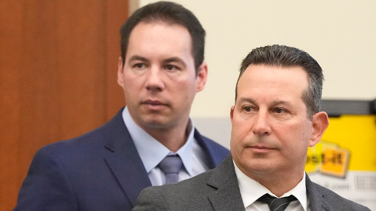 FILE —In this file photo from Feb. 28, 2022, Dr. William Husel, left, and defense attorney Jose Baez stand during Husels trial in Columbus, Ohio. A jury on Wednesday, April 20, 2022 acquitted Husel in the deaths of multiple hospital patients. Husel was accused of ordering excessive painkillers for patients in the Columbus-area Mount Carmel Health System.
