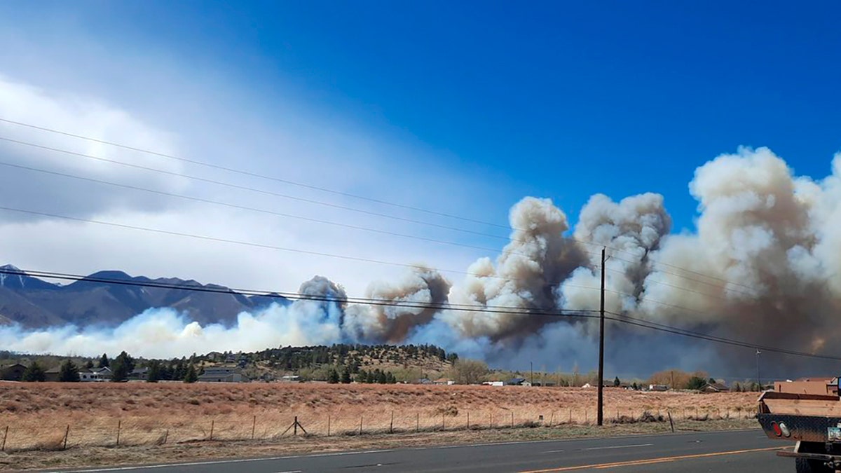 Smoke from the Tunnel Fire fills the sky in Doney Park, outside Flagstaff, Ariz., on Tuesday, April 19, 2022. (Cheryl L. Miller-Woody via AP)