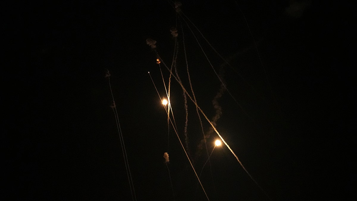Israel's Iron Dome air defense system launches missiles to intercept rockets fired from the Gaza Strip toward Israel, over Gaza City, early Thursday, April 21, 2022.