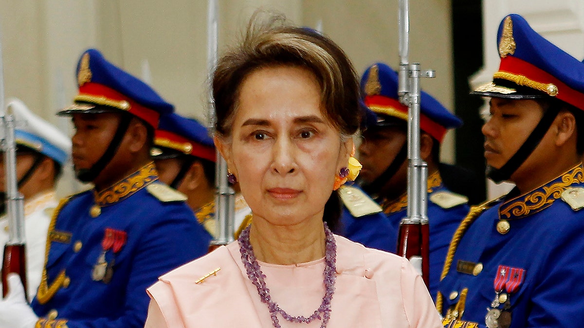 Aung San Suu Kyi reviewing an honor guard at the Peace Palace in Phnom Penh, Cambodia on April 30, 2019. 