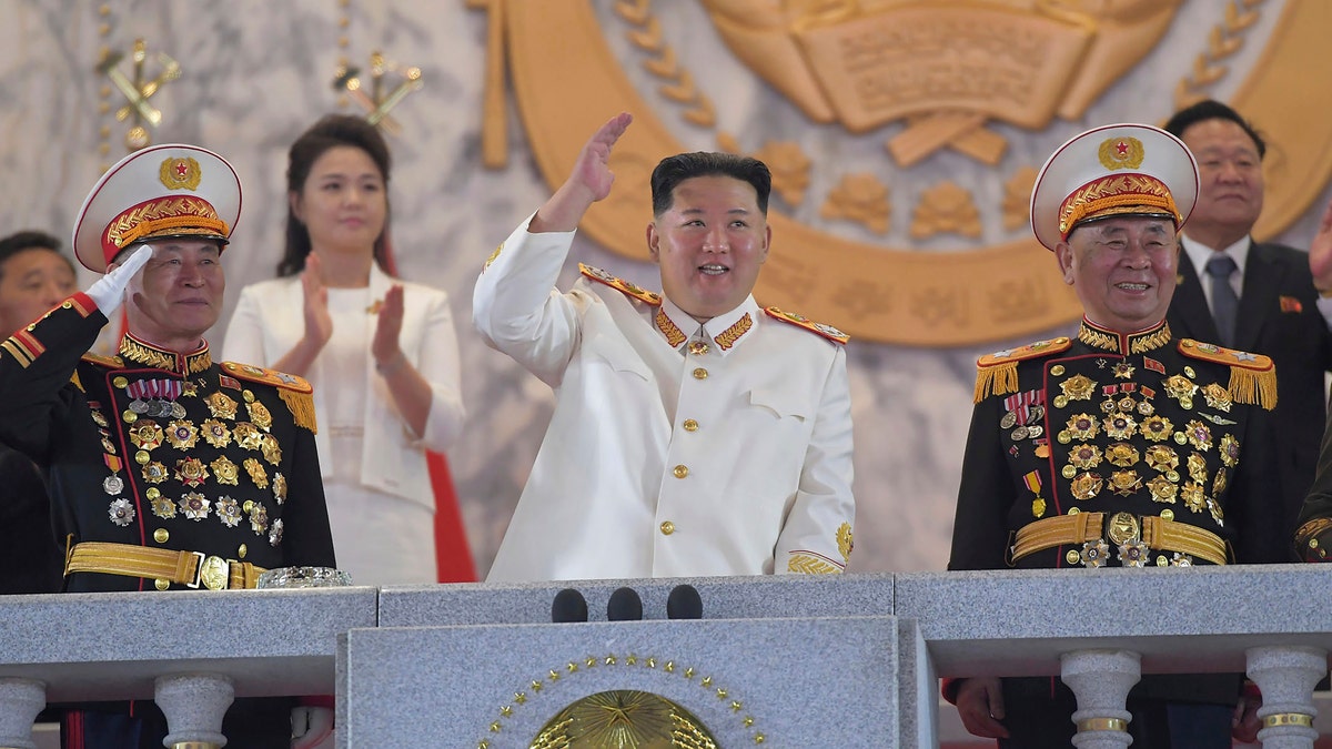 In this photo provided by the North Korean government, North Korean leader Kim Jong Un, center, watches a military parade to mark the 90th anniversary of North Korea's army at the Kim Il Sung Square in Pyongyang, North Korea Monday, April 25, 2022. (Korean Central News Agency/Korea News Service via AP)