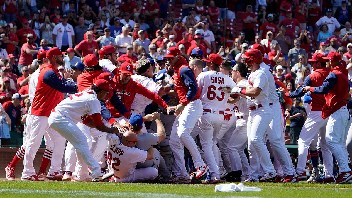 Benches clear during the eighth inning of a baseball game between the St. Louis Cardinals and the New York Mets Wednesday, April 27, 2022, in St. Louis.