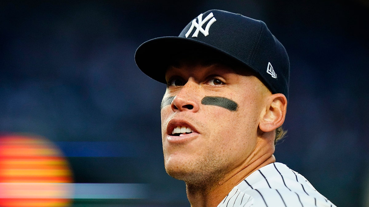 New York Yankees' Aaron Judge reacts to fans during the first inning of a baseball game against the Toronto Blue Jays, Monday, April 11, 2022, in New York.