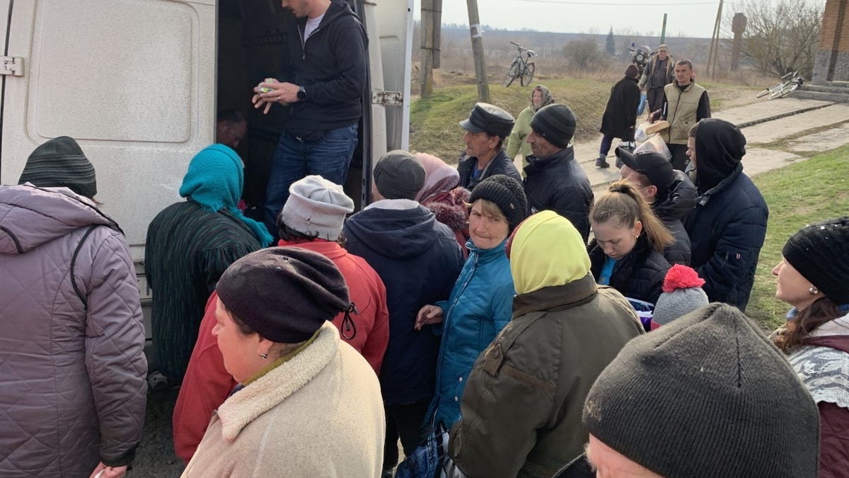 Andrew Moroz is a Ukrainian-born pastor in Lynchburg, Virginia. He is seen here distributing aid in Ukraine in April 2022.