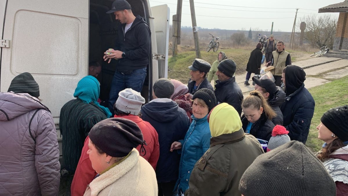 Andrew Moroz is a Ukrainian-born pastor in Lynchburg, Virginia. He is seen here distributing aid in Ukraine in April 2022.
