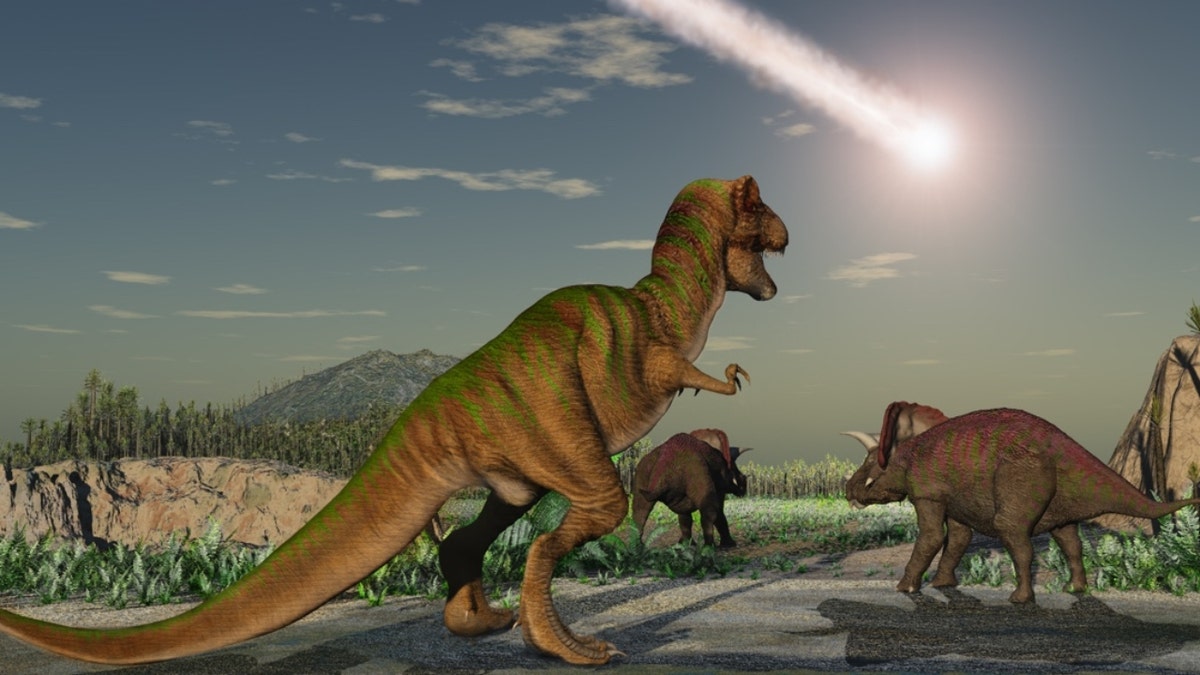 illustration of asteroid in sky above dinosaurs