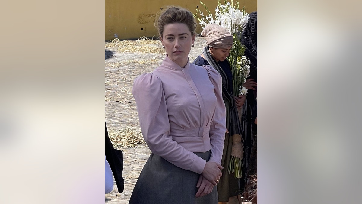 Amber Heard in costume on set of "In The Fire"