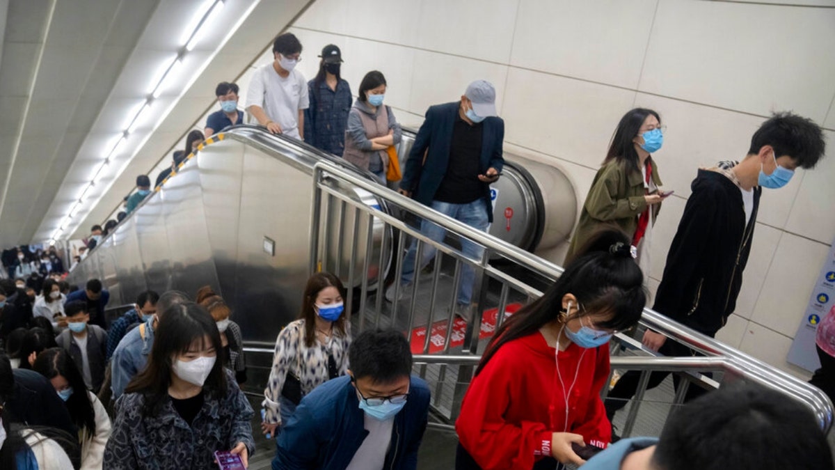 People in a Beijing subway station